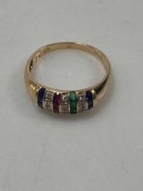 A hallmarked 9ct gold multi stone set dress ring weight 2.4g