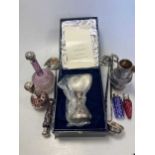 A collection of silver mounted glass perfume bottles, together with three punch ladles, a cream