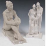 A plaster nude figure ornament and another of two figures together feeding penguins (2) Couple
