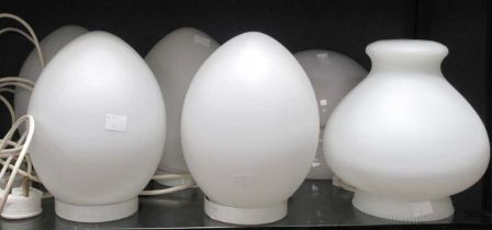 Four 1980's egg form white opaque glass lamps, together with one sectional ovoid lamp and a white