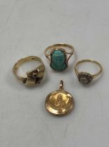 A religious pendant tested as 18ct gold, a ring stamped '18CT' and another ring hallmarked 18ct