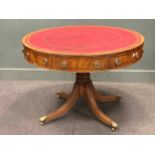 A Regency style mahpgany drum top library table with faux leather inset top 108cm diameter