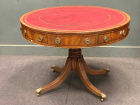 A Regency style mahpgany drum top library table with faux leather inset top 108cm diameter