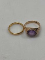 A hallmarked 22ct gold wedding band, weight 2.8g, together with a hallmarked 9ct gold amethyst ring,