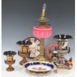 A late Victorian brass oil lamp with pink glass reservoir together with various vases and plates,