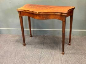 A George III mahogany serpentine foldover top card table 73 x 92 x 45cm closed 72 x 92 x 90cm open