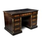 A Victorian Aesthetic Movement ebonised and boxwood inlaid twin pedestal desk