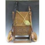 A 20th century oak box stool, two copper warming pans, a 19th century pierced brass skimmer and a