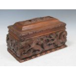 A 19th century rectangular wooden table casket embellished with 16th century relief carvings, and