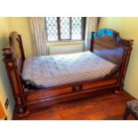 A French kingwood and rosewood small double bed with gilt metal mounts