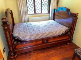 A French kingwood and rosewood small double bed with gilt metal mounts