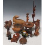 Various wooden, stone, horn and metal ethnic collectables including a carved wood seal, stone