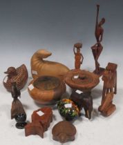 Various wooden, stone, horn and metal ethnic collectables including a carved wood seal, stone