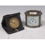 A 20th century oval shape carriage timepiece, 8 x 10 x 7cm, together with a Swiss bedside alarm