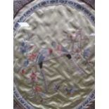 An oval Chinese textile love birds, 39 x 34cm