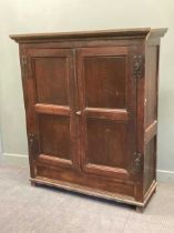 An oak panelled two door hanging cupboard, 165 x 147 x 55cm