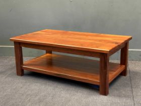 A two-tier hardwood coffee table, 41 x 110 x 63cm and a circular brass embossed occasional table, 66