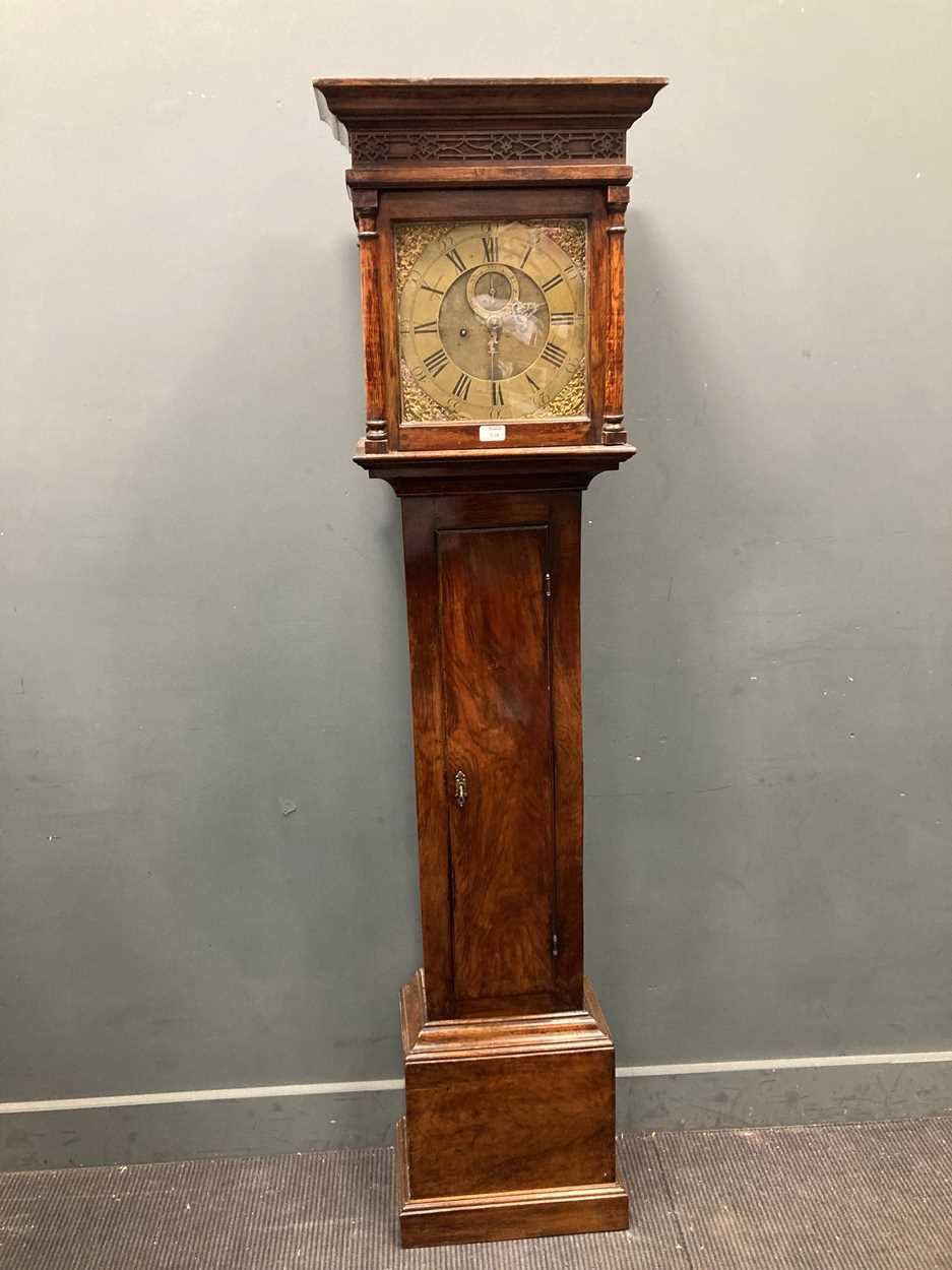A brass dial walnut longcase clock (18th century and associated to later case), 195cm high