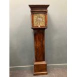 A brass dial walnut longcase clock (18th century and associated to later case), 195cm high