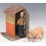 Early 20th century French or Belgian painted composition clockwork pig, and a farmer with a shed