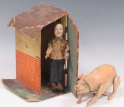 Early 20th century French or Belgian painted composition clockwork pig, and a farmer with a shed