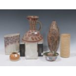 A large collection of modern and ethnic ceramic items, including a vase by Diana Reytan, tallest