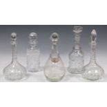 A collection of five cut glass decanters, one with a decanter label, 31cm high and similar