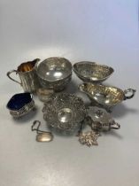 A collection of silverware including milk jugs, bowls, sauce boat, cruets etc, 30.9ozt weighable