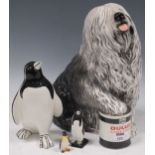 A Beswick Dulux advertising Old English Sheepdog with paint tin; together with small Beswick and