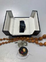 A string of amber beads, a paste necklace, a pietra dura brooch and a Raymond Weil watch (4)