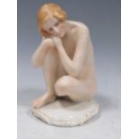 A Karl Ens figure of a seated nude, 17cm high