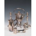 A collection of sliver plated items including kettle, candlesticks, sauce boats, breadbasket,