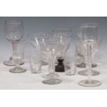 A collection of blown glass goblets and wine glasses, including some earlier examples and one with a