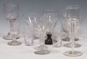 A collection of blown glass goblets and wine glasses, including some earlier examples and one with a