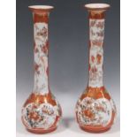 A pair of orange and gilt Chinese vases, decorated with blossoms and birds, 33cm high (2) Both vases