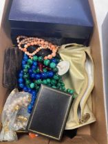 A large collection of beads and costume jewellery