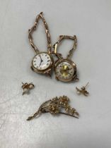 A pearl brooch stamped '9CT', a pair of hallmarked 9ct gold earrings and two watches, gross weight