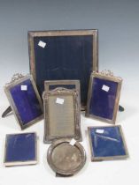 7 silver photo frames and another unmarked (8)