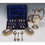 A collection of silver including cased flatware, a tea caddy, wine ewer hair brushes etc, 23.8ozt