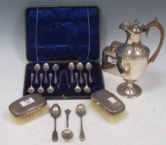 A collection of silver including cased flatware, a tea caddy, wine ewer hair brushes etc, 23.8ozt