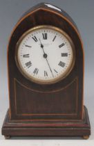 An Irish (Belfast) retailed arch top mantel clock, early 20th century, and an Edwardian mahogany