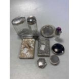 A silver card case, a mother of pearl card case, two silver pill boxes, a silver and tortoiseshell