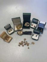 Eight pairs of earrings and a St.Christopher pendant, all assessed as 9ct gold, gross weight 14g,