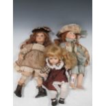 Three bisque head dolls, including one named Hannah