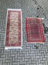 A yellow ground runner with floral decoration, 226 x 83cm; together with a wool prayer rug, 145 x