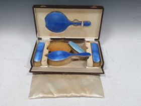 Silver and enamelled hairbrush set, boxed Some chipping to the enamel tops on one hairbrush and