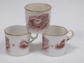 Three Minton coffee cans with Sevres marks, painted with shells, gilt rim and leaf heads and a