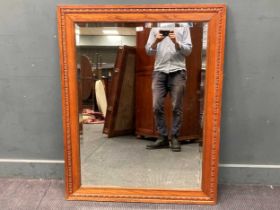 An oak moulded frame mirror with bevelled plate, 20th century 95 x 119cm