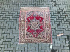 A Red ground Persian-style rug, possibly Indian, 164 x 133cm