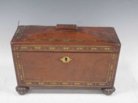 A Rosewood and brass inlayed tea caddy of sarcophagus form